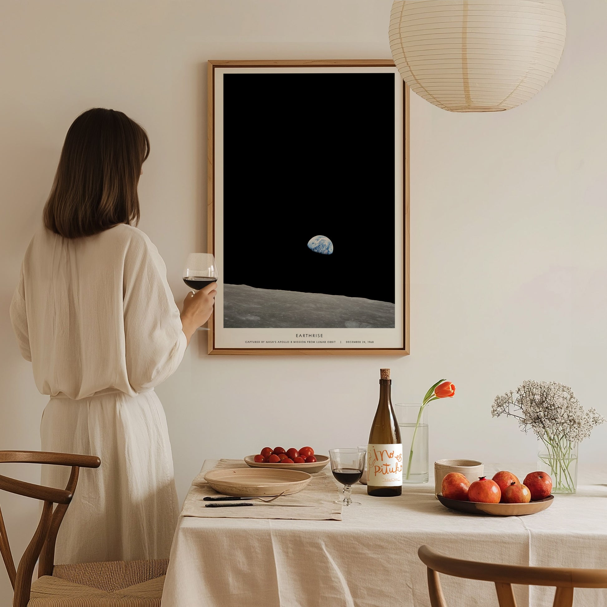 Earthrise NASA Apollo 8 print illuminated by natural window light in a reading nook