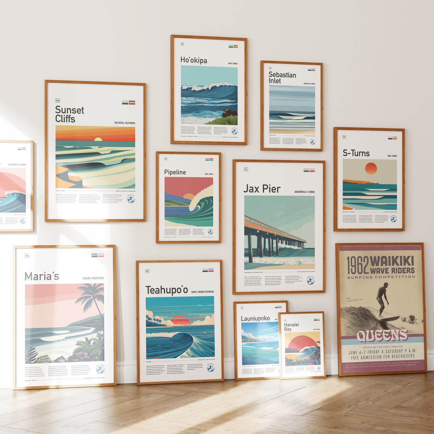 A gallery wall featuring a variety of framed art prints depicting serene ocean scenes and surf spots, including titles like Sunset Cliffs and Pipeline.